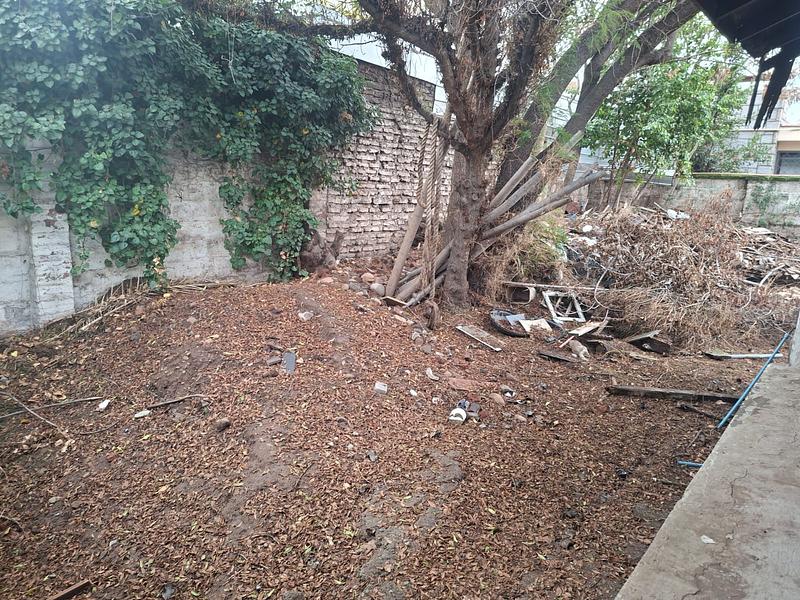 Gran Terreno de 611 m² en Barrio Simón Bolívar, Ñuñoa | Sólida Casa Familiar con Enorme Potencial