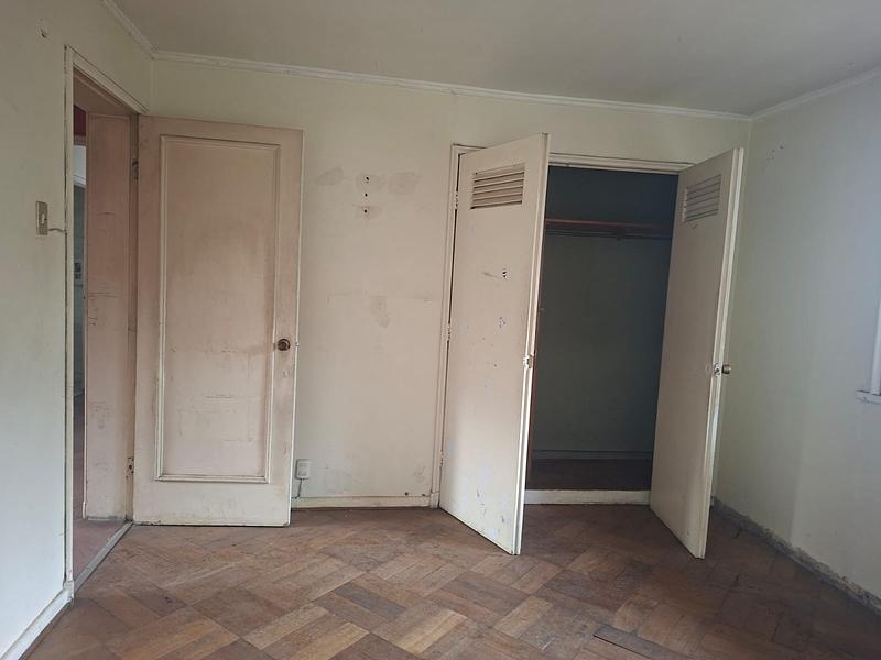 Gran Terreno de 611 m² en Barrio Simón Bolívar, Ñuñoa | Sólida Casa Familiar con Enorme Potencial