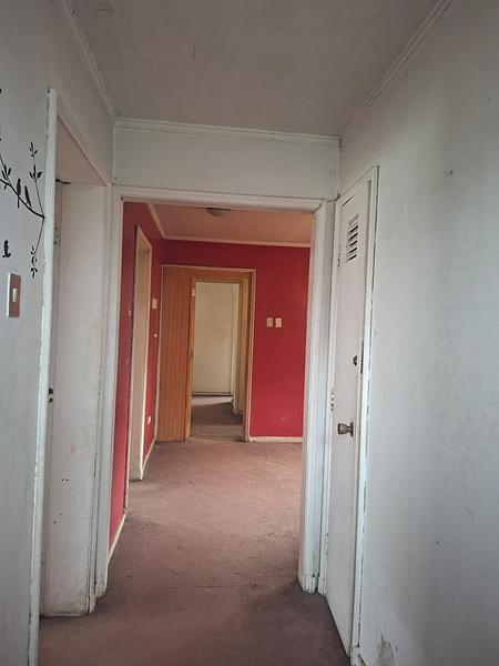 Gran Terreno de 611 m² en Barrio Simón Bolívar, Ñuñoa | Sólida Casa Familiar con Enorme Potencial
